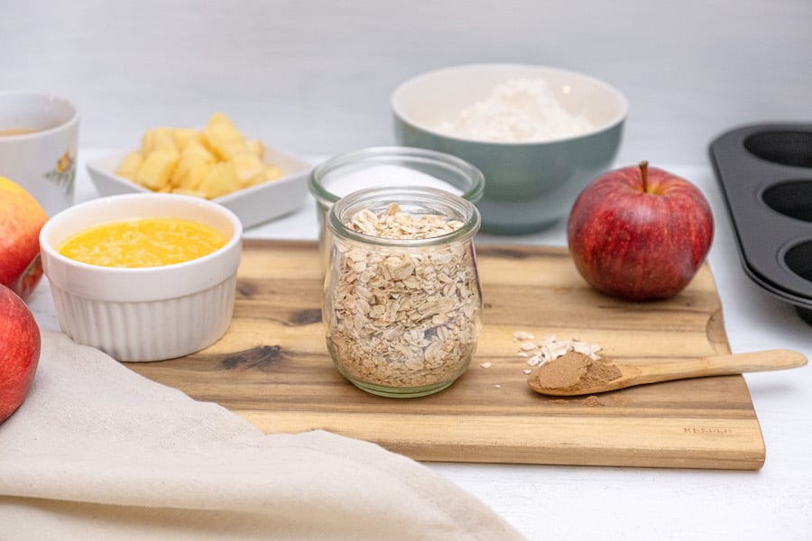 apple cinnamon muffins ingredients on a cutting board
