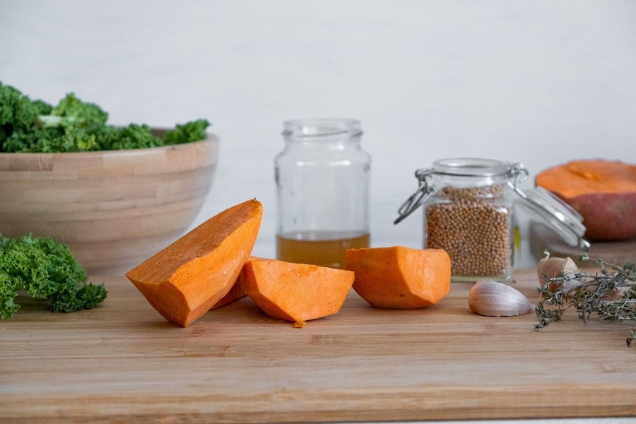 chopped sweet potatoes on cutting board