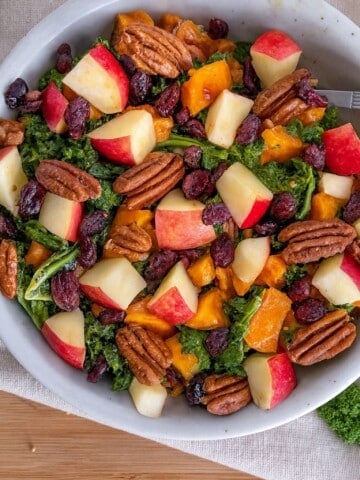 kale and sweet potato salad in white bowl