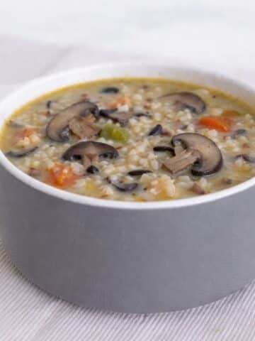 mushroom and wild rice soup in white bowl
