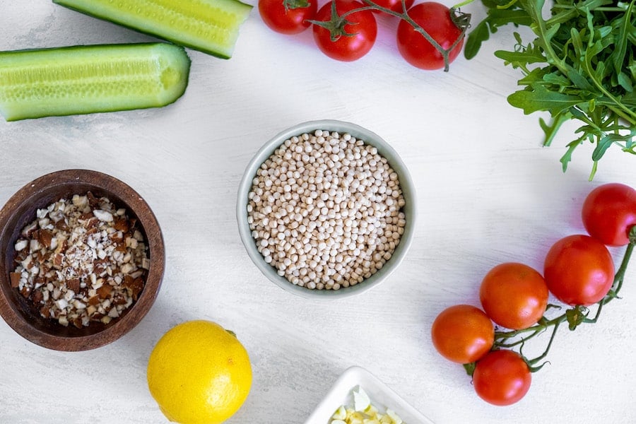 Salad ingredients on white counter