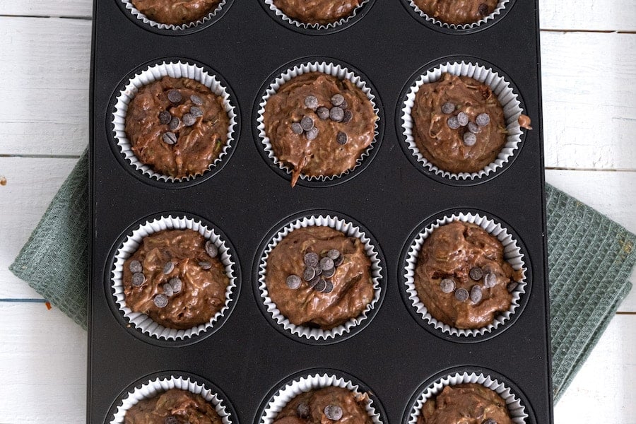 chocolate zucchini muffin batter in tin